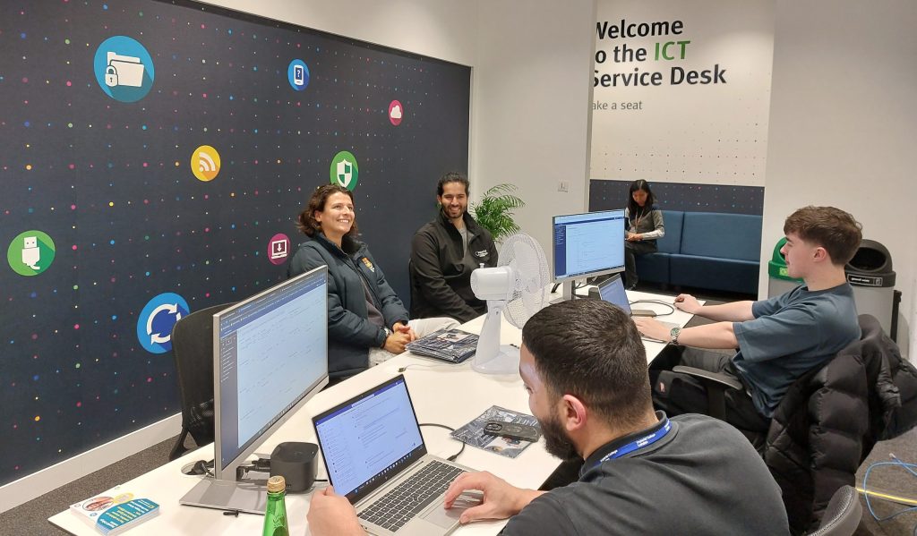 ICT Service Desk at White City with staff and students sitting at the desk