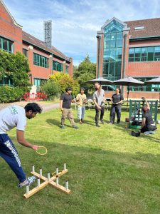 Staff members playing games on the Silwood lawn