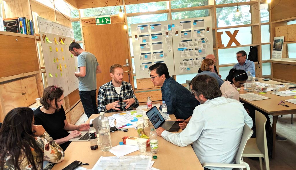 A photograph of people at a workshop at the Helix Centre