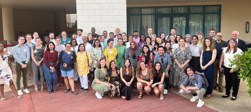 In person attendees pose at the end of the CCM GLobal event