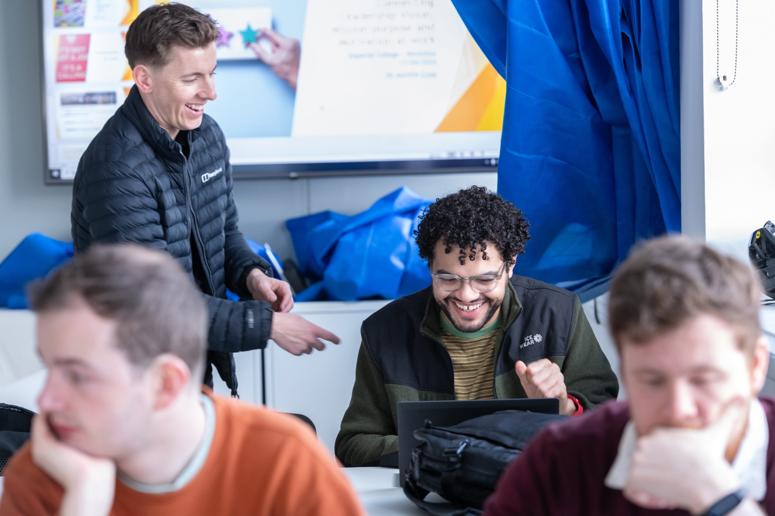 Students informally chatting in a classroom