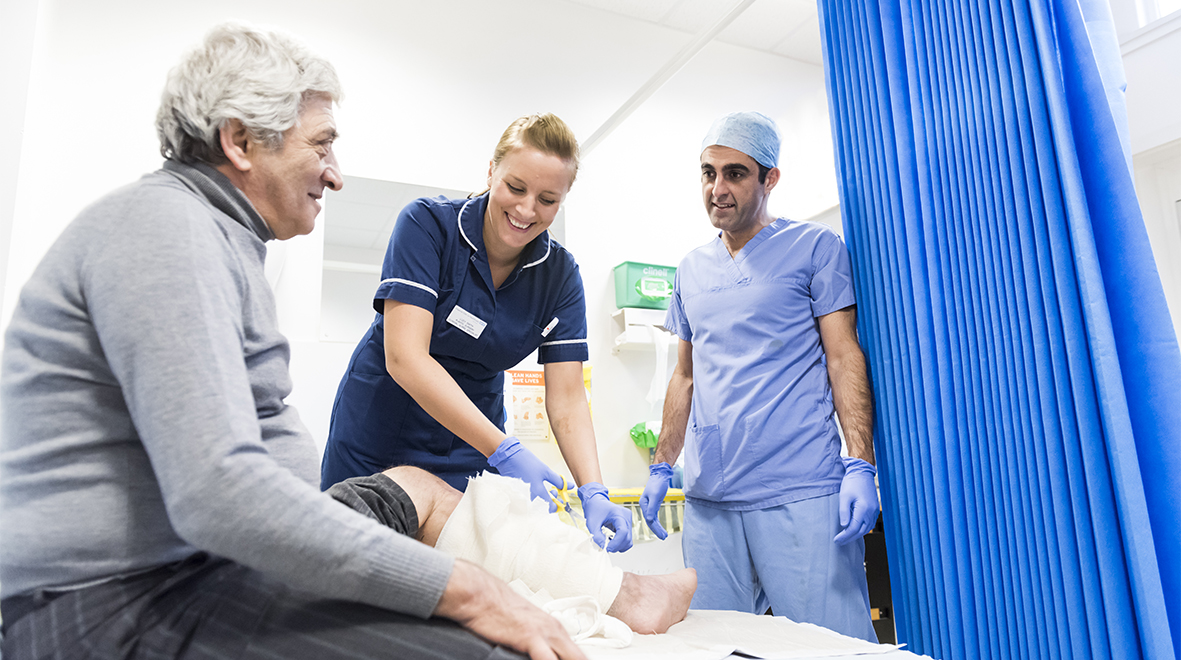 NHS staff with a patient at Charing Cross Hospital