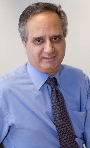 Portrait photo of professor Azeem Majeed