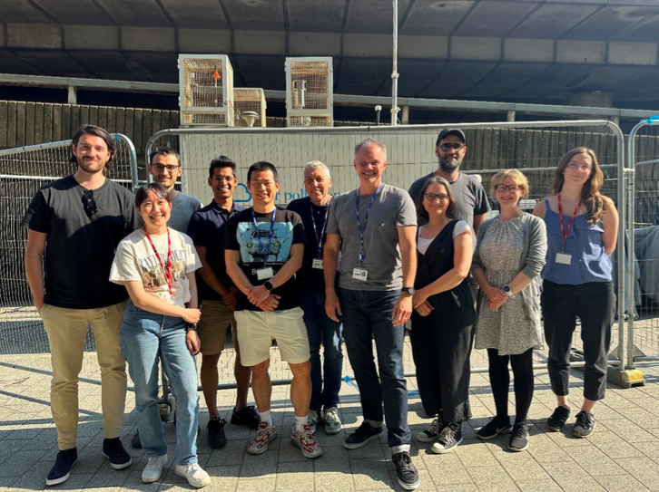 Group photo of Aerosol Science Team at Imperial’s Environmental Research Group in front of an air quality monitoring site (Ian is fifth from the left) 