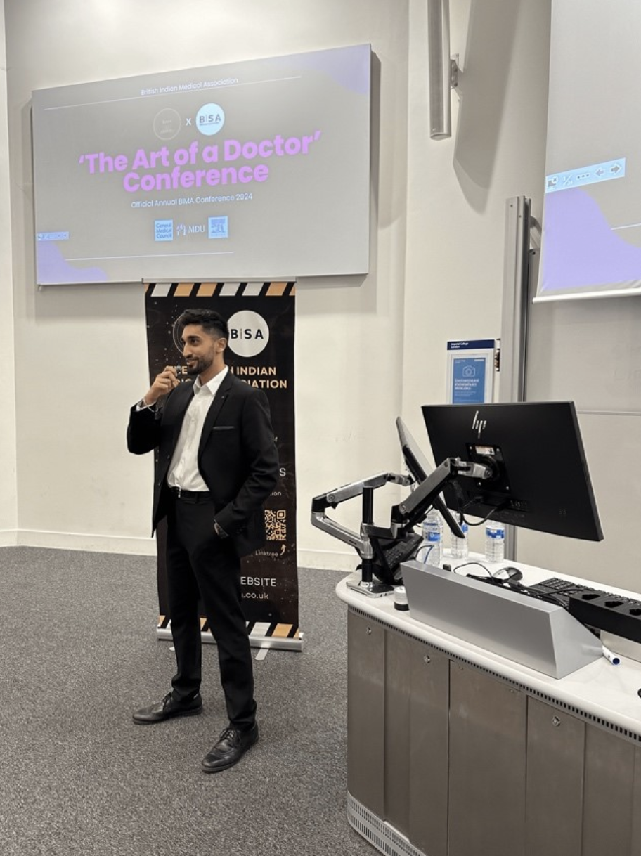 Harroop Bola delivering a speech during the 3rd Annual BIMA Conference at Imperial College London 