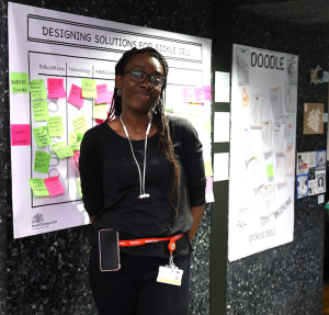 Woman standing in front of a research poster