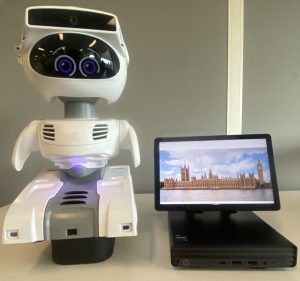 A robot next to a tablet device