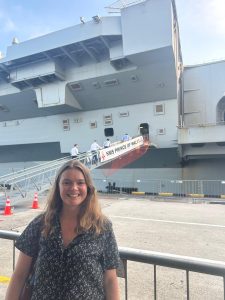 Paige Noyce in front of the HMS Prince of Wales