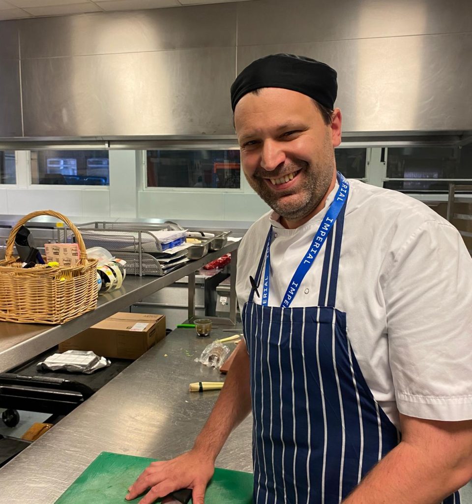 Emanuele in his chef outfit in a kitchen
