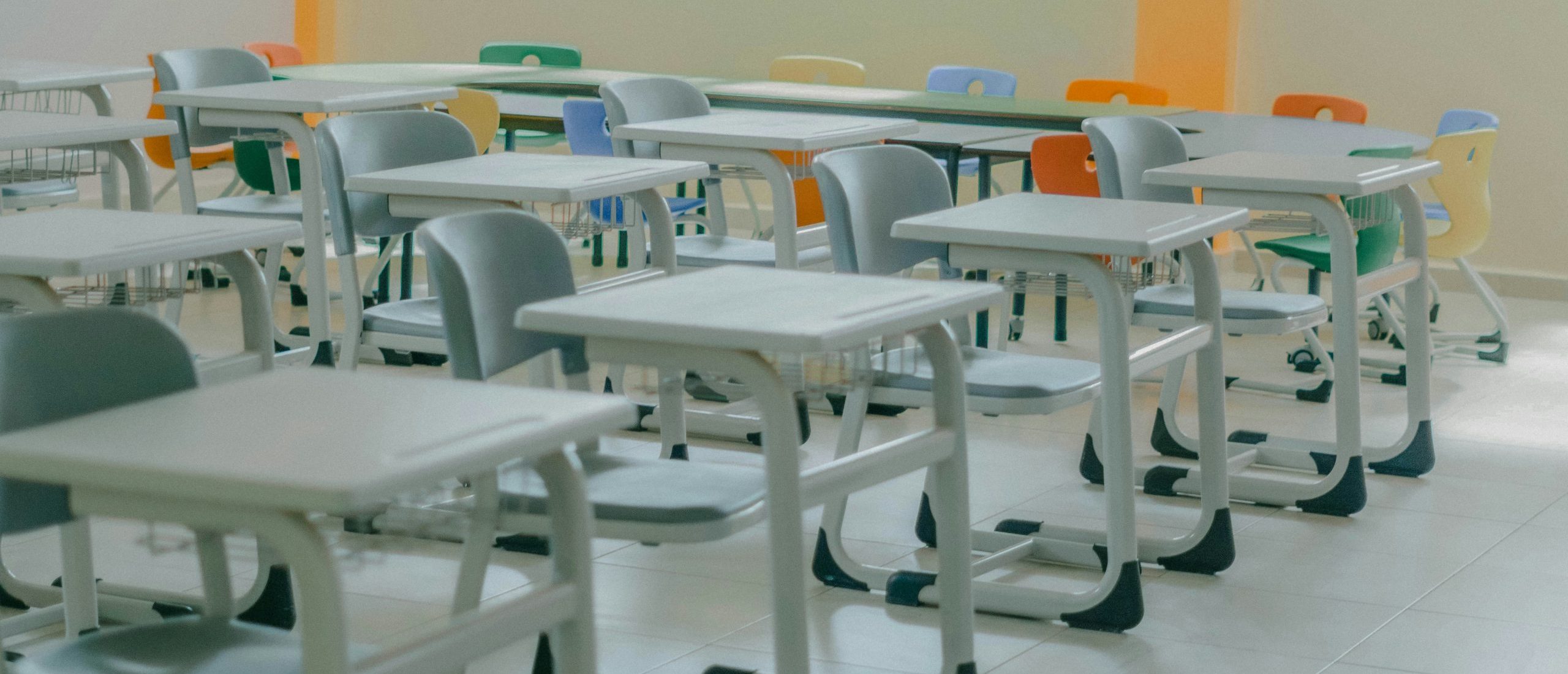 Photo of empty classroom desks