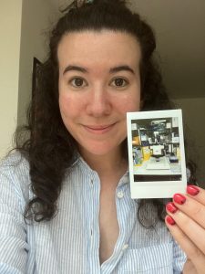 Elena showing a little polaroid of her favourite microscope.