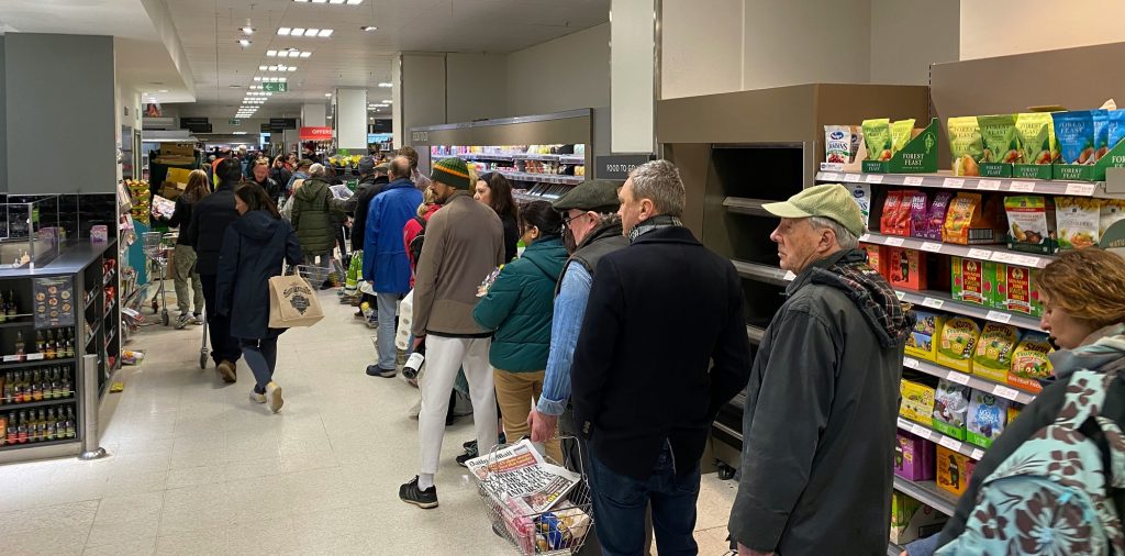 Supermarket queue. Photo by John Cameron on Unsplash