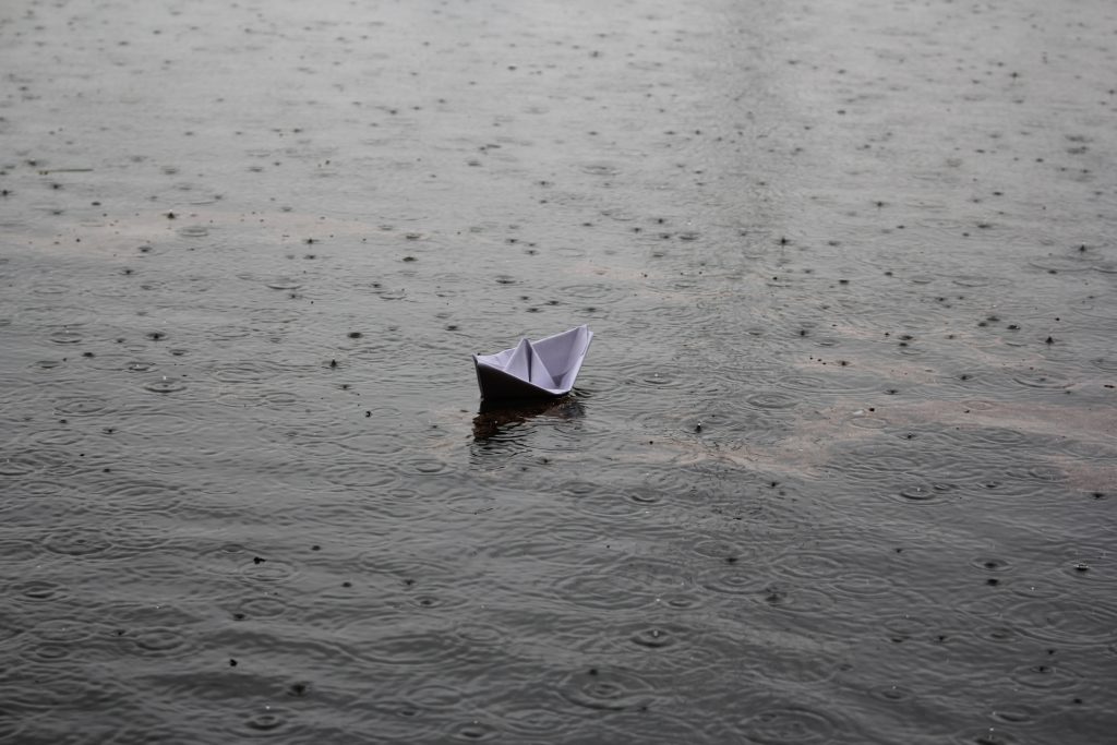 paper origami boat on water