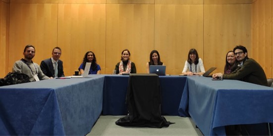 Research team sat around table