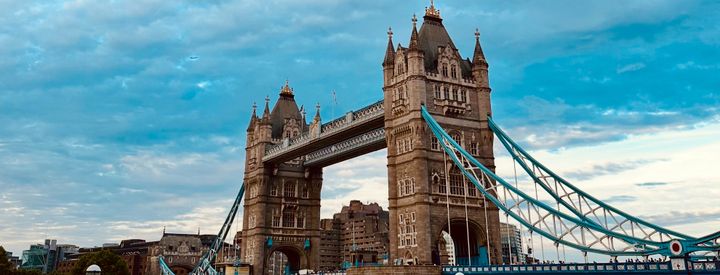 Looking up at Tower Bridge in London with blue skies in the background
