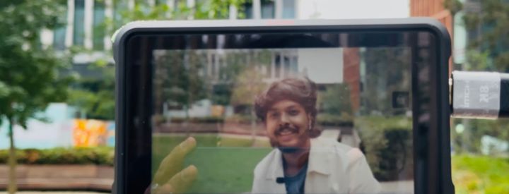 A photo of a phone screen filming Vijay