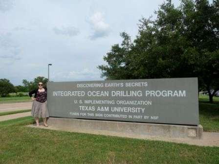 Imperial PhD student Carys Cook in front of the IODP sign in College Station/Texas.